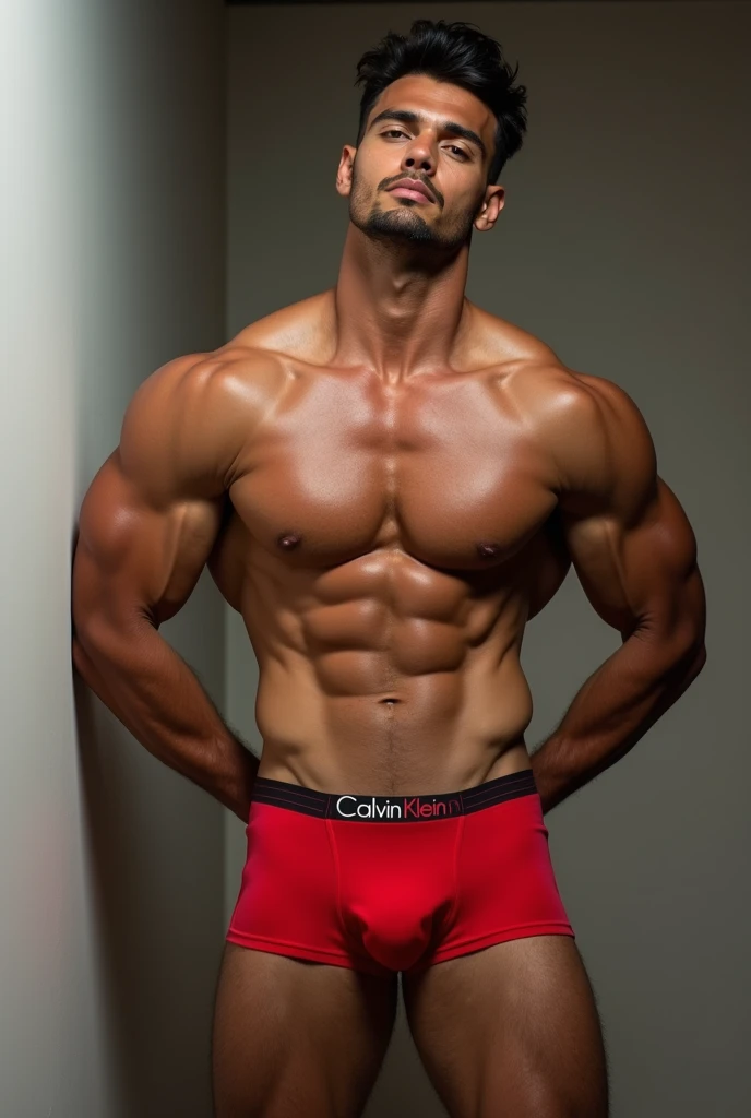 a hot six pack man showing his huge dick while wearing red calvin klein underwear