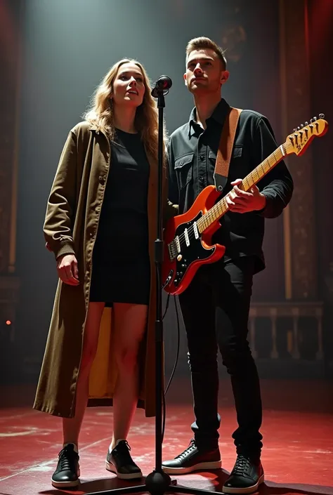 a tall woman wearing a black t-shirt and a black short skirt and sports shoes and a fancy army long coat is singing on a magnificent stage alongside a short man in an open buttoned formal shirt who becomes her guitar