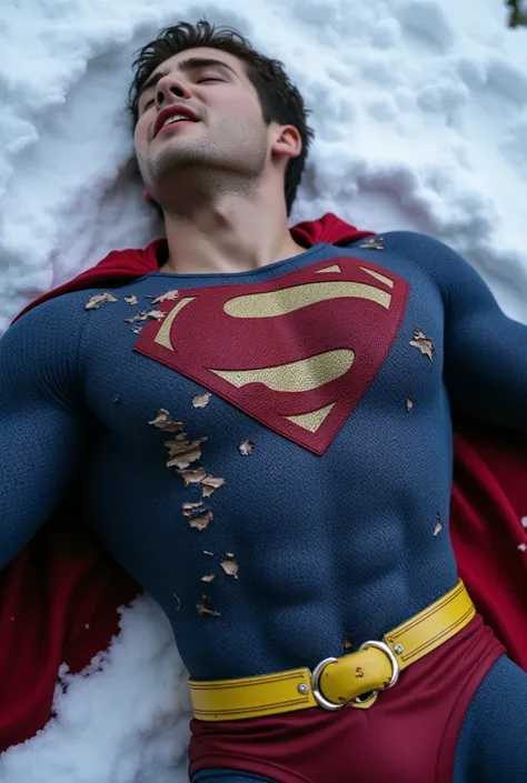 Cody Christian attractive, muscular, strong physique, dressed in a torn Superman costume, yellow belt, with his head tilted slightly upward and his eyes closed, He lies in the snow, with an expression of pain, with blood on his lips, full body shot