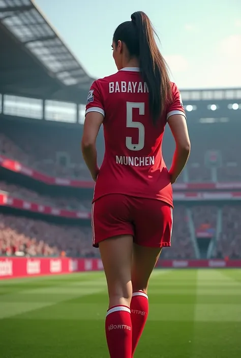 A woman soccer player wearing a Bayern shirt in the stadium with a very very big butt from behind