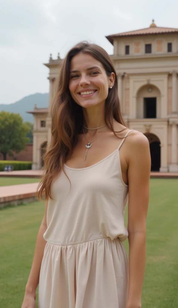 A 37-year-old woman in a simple dress, posing in front of a historical building.