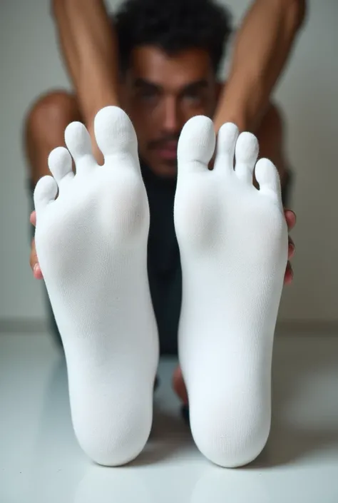 man wearing white socks、 showing off the soles of the feet