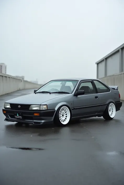 The 1994 Toyota great Corolla car is gray with volk rays te37 alloy wheels in fast white