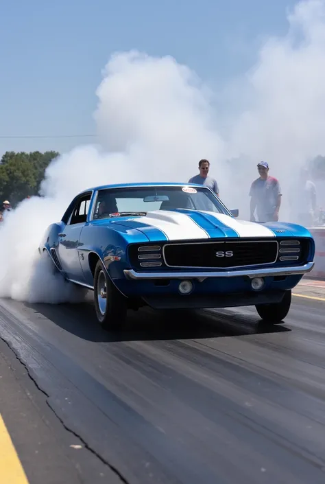 1969 blue Chevrolet Camaro, with white stripes, burn out, at drag strip.