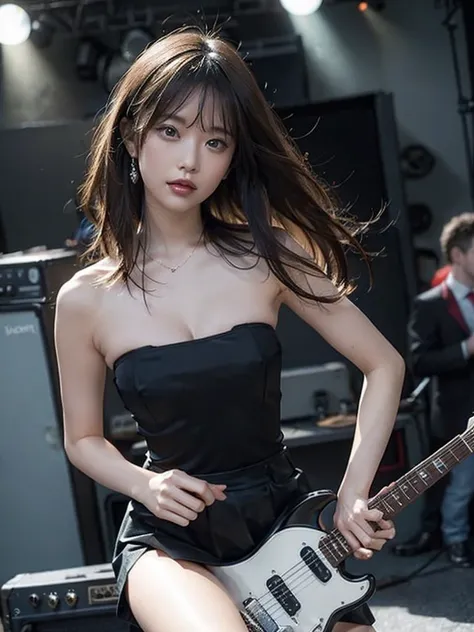 A sexy woman playing a rock guitar, dressed in a strapless top and a mini skirt.stage