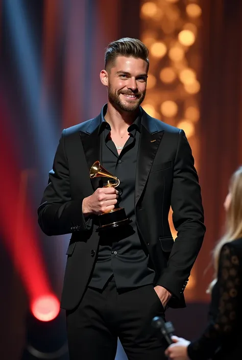 Create an image of Simon Nesman  ,  light brown hair , Wolf Cut Haircut  ,  athletic body, beard,   sky blue eyes meets formal black pants and a tight silk shirt on a Latin Grammy stage with an award smiling while being interviewed by a girl 