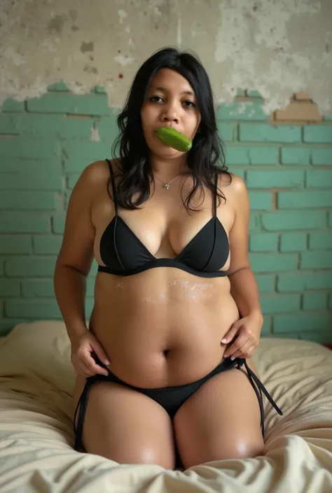 An Indonesian slightly chubby woman with shoulder length wet hair wearing X black tape covering her tits and thigh string small panty sitting squatting straddling on rubber small stick with human skin color stuck on bed with beige sheets, one hand lifting ...