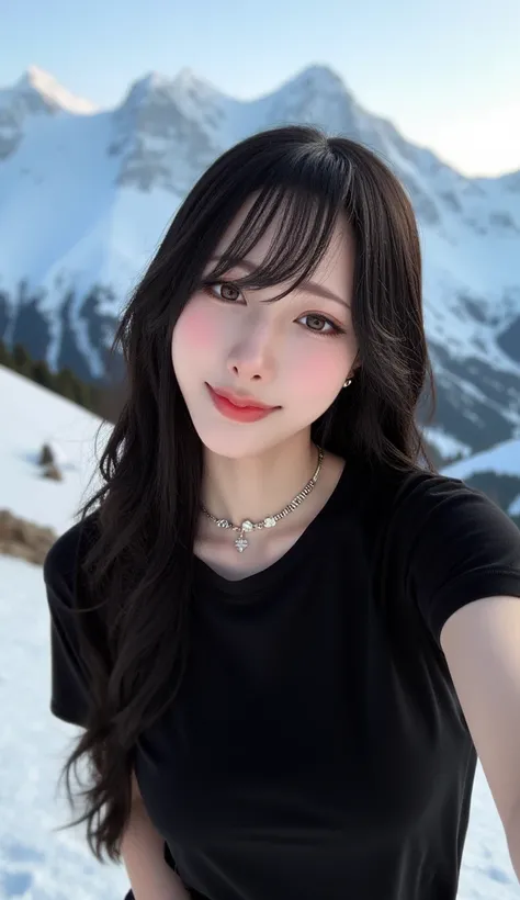 The image is a selfie of a young woman posing for a photo in front of a snowy mountain. She is wearing a black tshirt and a black choker necklace. Her long dark hair is styled in loose waves and she is looking directly at the camera with a slight smile on ...