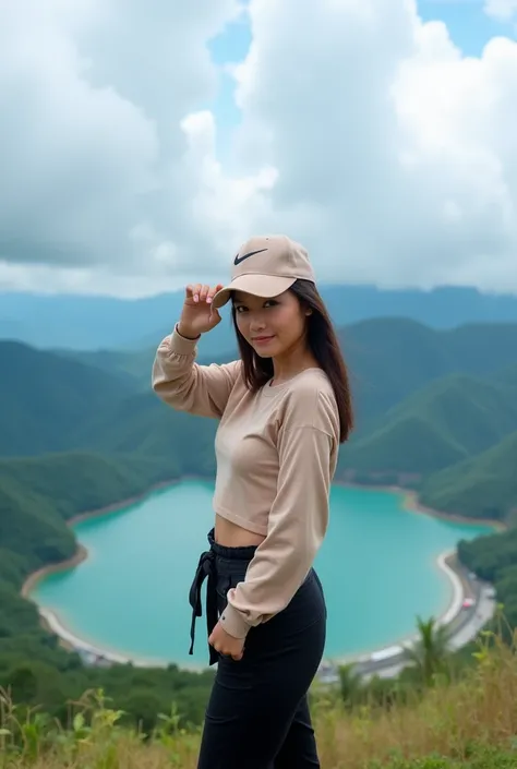 Beautiful Indonesian woman wearing a Nike hat standing, with a stunning natural scenery in the background. Behind her are green hills surrounding a large lake, with a bright blue sky decorated with thick white clouds. The woman is wearing casual clothes in...