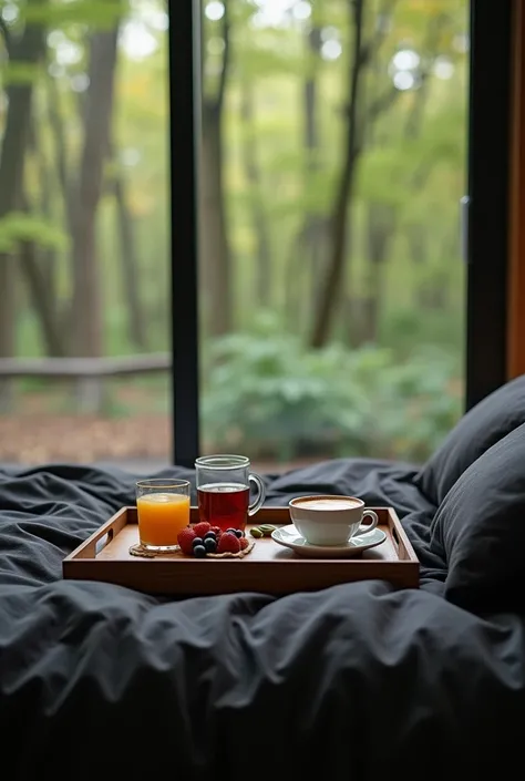 Create the image of a coffee tray on top of a kingsize black sheet bed with a modern window overlooking the forest .  Place two cups of cappuccino, a glass of juice, two filled with jelly on a saucer and next to it a box of grapes and strawberries.. Image ...