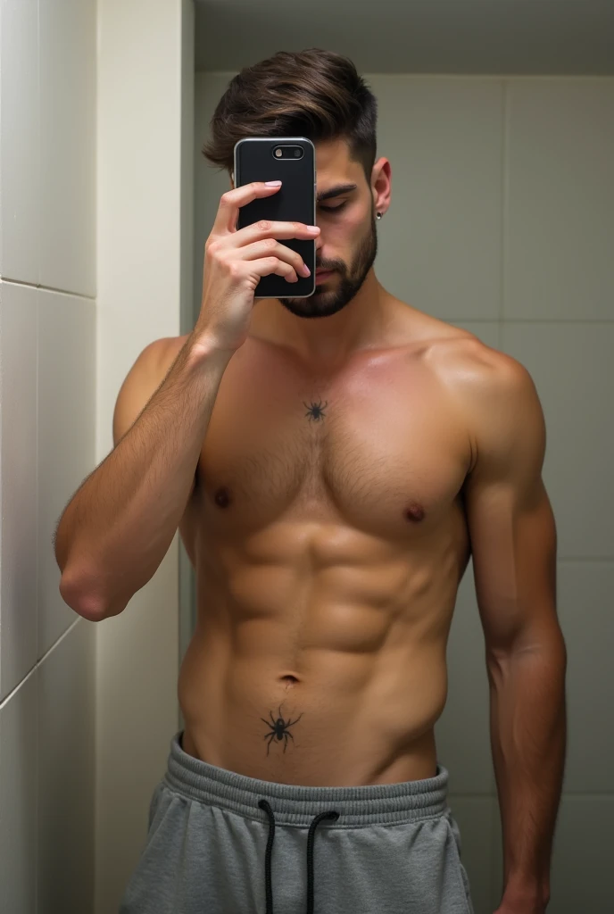 a picture of a man only his abs in the photo, hes wearing gray joggingpants he have ripped abs 6packs and he have a small spider tattoo in his left side, hes around 24, no face just his body while in the mirror shot hokding his phone, hes in the bathroom h...