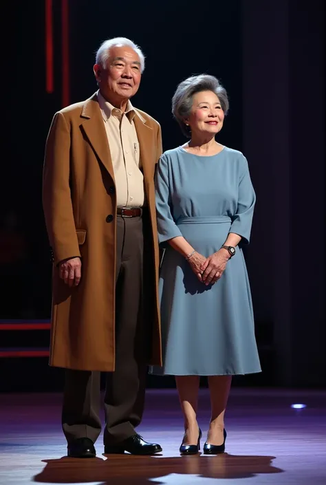 An elderty Asian couple standing on the iconic stage of Americas Got Talent captured in a dramatic and elegant moment. The man is wearing a long brown overcoat with a formal beige shirt underneath, paired with dark brown trousers and simple, polished shoes...