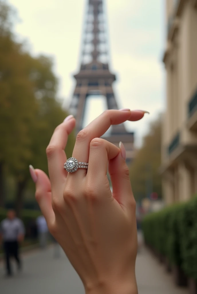  The hand of a woman with a wedding ring on her corresponding finger,  very realistic image , That the background is blurred and with the Eiffel Tower  