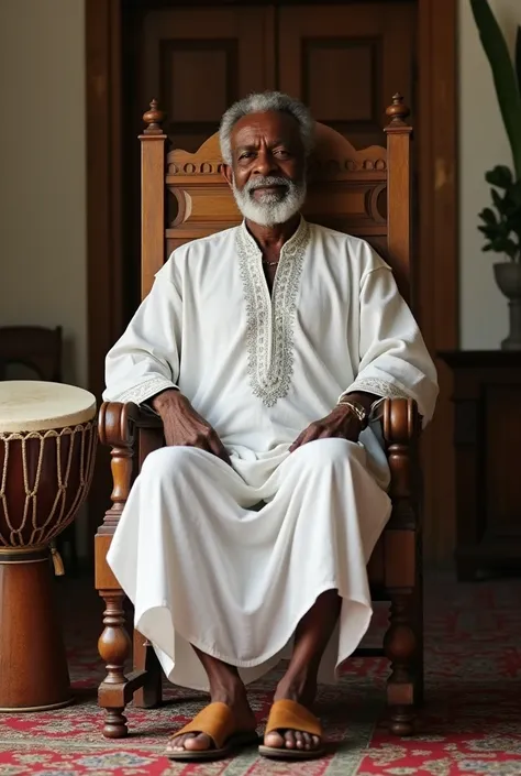  A middle-aged white man without a beard , ,  wearing white candomblé clothes ,  with leather sandals , sitting in a large chair of mothers .  There is a drum on your left side and on your right side a bible on a wooden table...