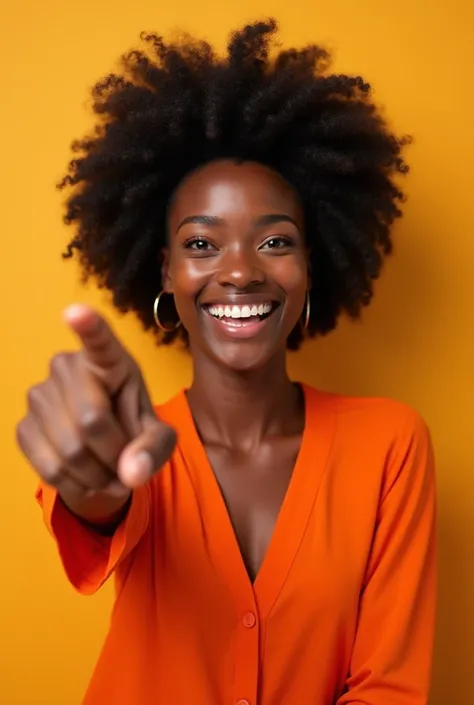 Young black woman , smiling,  wearing an orange blouse, pointing to the left