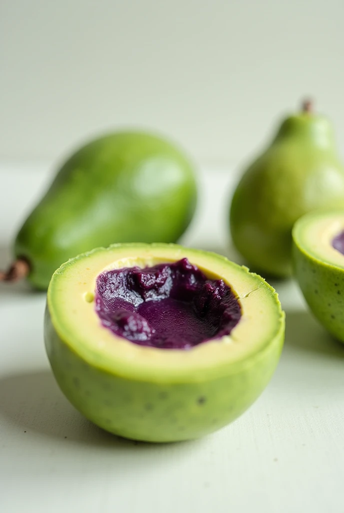 Green avocado baked goods with blueberry filling wrapped inside. The filling is not runny. The part outside is green, the color of avocado. The filling is dark purple as blueberries.