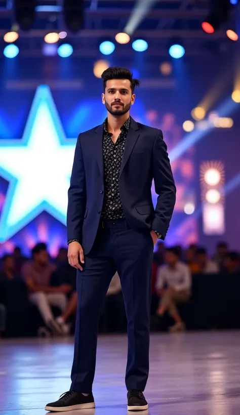 A confident 25-year-old man with a sharp, modern hairstyle, dressed in a tailored navy blue suit with a patterned black shirt and casual sneakers, standing on a brightly lit stage. The background features a large star-shaped LED display, vibrant lighting, ...