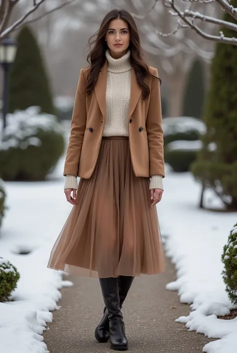 A woman in a perfectly cut blazer layered over a soft, knitted turtleneck, combined with a flowy midi skirt. She completes the look with knee-high boots and stands confidently in a scenic winter garden