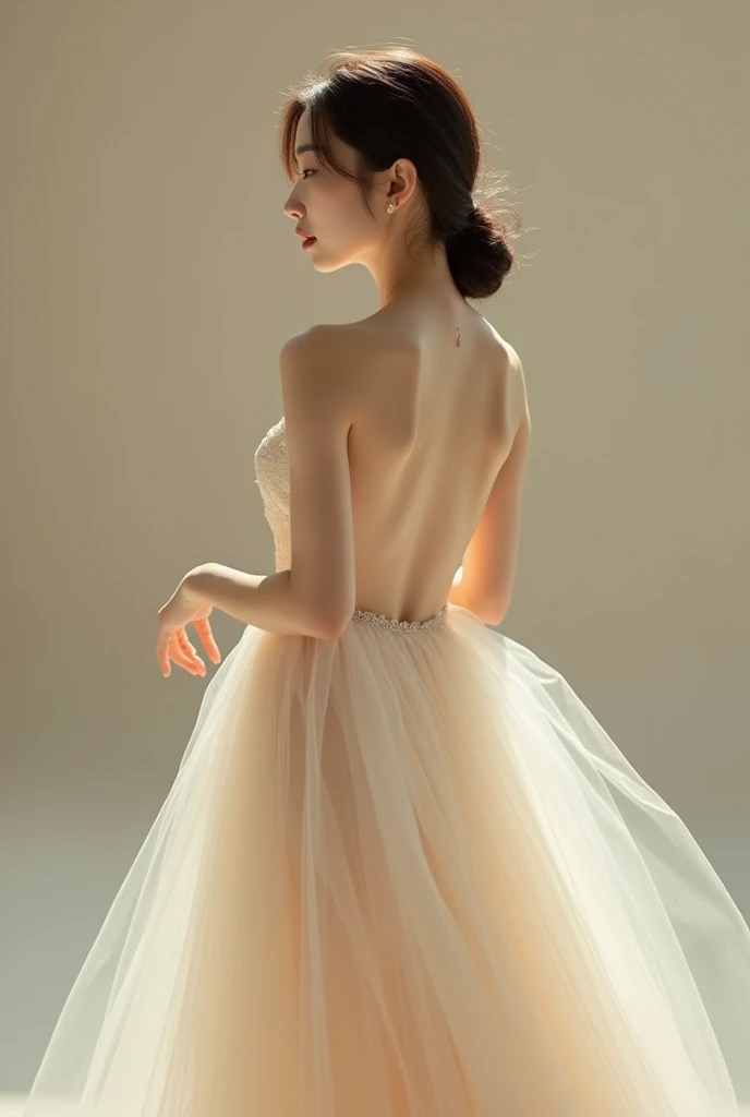 A fine art portrait of a Korean woman in a white backless gown, adorned with layers of soft, flowing tulle. The composition emphasizes her elegant posture, her gaze directed over her shoulder with an air of quiet confidence. The lighting is soft and diffus...