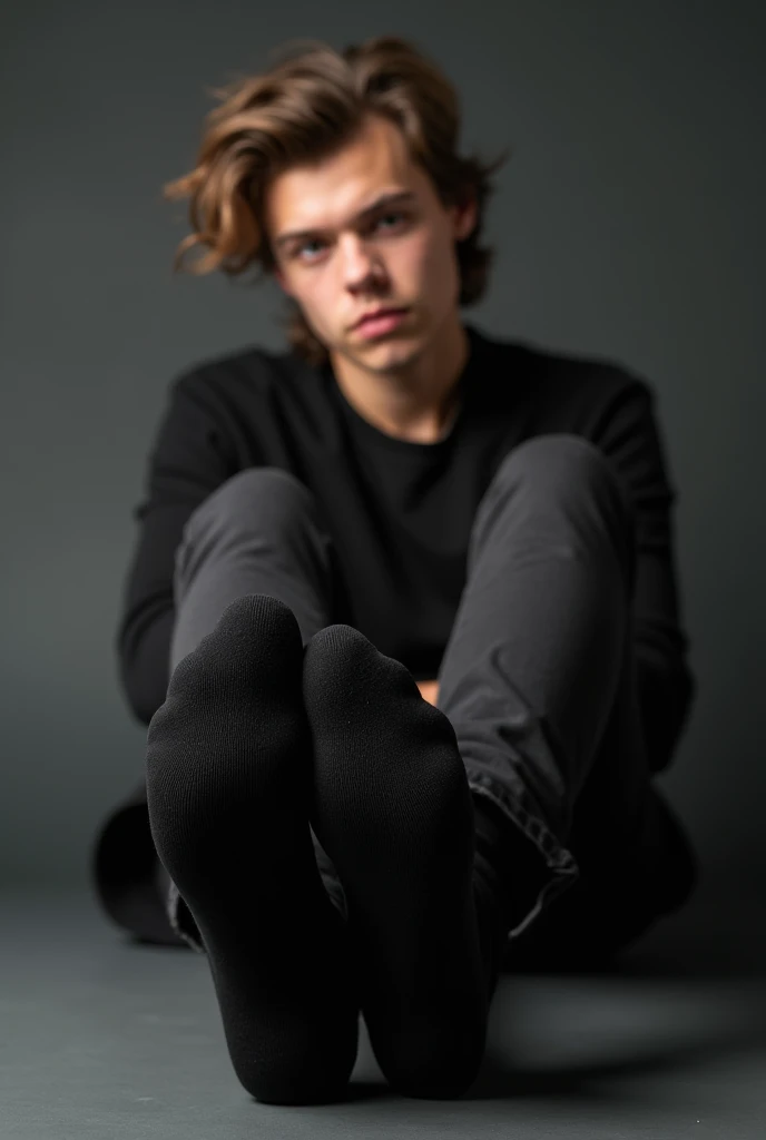 Black socks mock-up. Close up. of Harry styles wearing a blank black socks , sitting on the floor