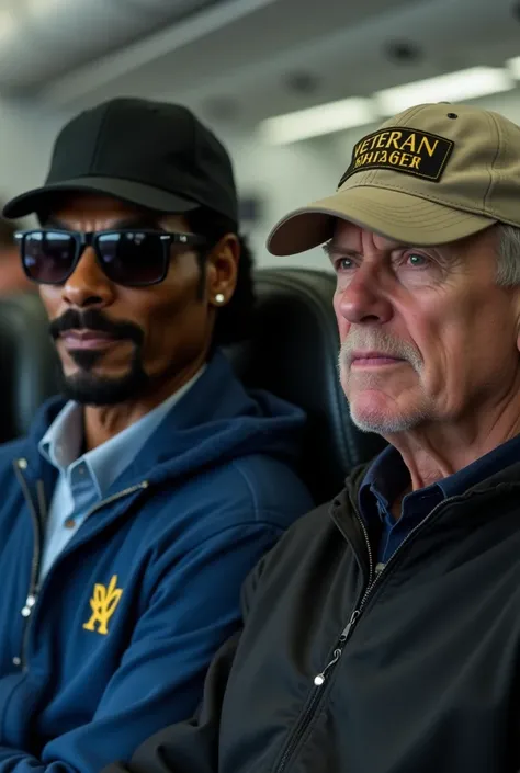 The image shows two men sitting on an airplane. The snoop dog on the left is wearing a blue jacket, a black baseball cap, and sunglasses. He has a mustache and is looking off to the side with a serious expression on his face. On the right is an older man w...