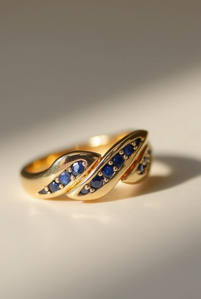 Create rings for women with a gold base with a subtle wave decoration inlaid with sapphire 