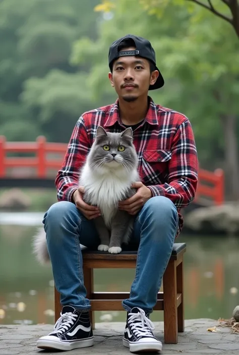  Photo of a 30 year-old Indonesian man wearing a black snapback hat wearing red and white flannel,  blue jeans , black and white ketz shoes , face looking at camera,   sitting on a wooden chair with a jumbo grey and white Persian cat , in a Chinese park th...