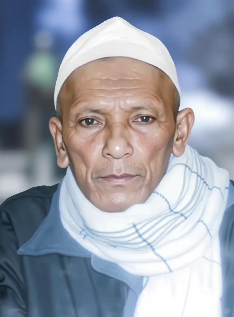 an old Indonesian man wearing a blue coat and a white scarf with blue stripes around his neck, as well as a white peci head covering