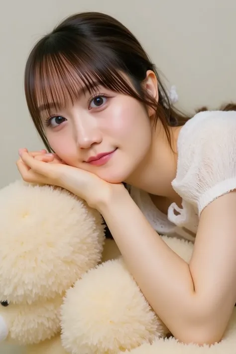  Korean girl lying on a cute teddy bear、Modeling photo of smiling with her hands on her face  