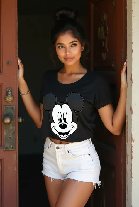 Portrait of a 23-year-old hot indian women with dusky skin, snub nose, wide lips and big eyes not wearing glasses with black hair in bun hair style with good physique and she is wearing a black t-shirt with micky mouse design on it and white shorts showcas...