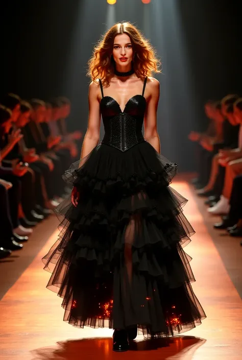 a young woman with chestnut curls walks from the front of the catwalk. black shoes on her feet. a choker on her neck. dress: tight black comment corset and a lush multi-layered floor-length skirt. side slit up to the thigh. the hem is ablaze with fire