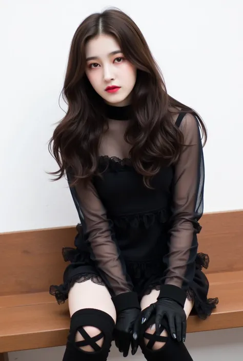 The image is a portrait of a young woman sitting on a wooden bench. She has long, dark hair that is styled in loose waves and falls over her shoulders. She is wearing a black dress with a high neckline and long sleeves. The dress is made of a sheer fabric ...