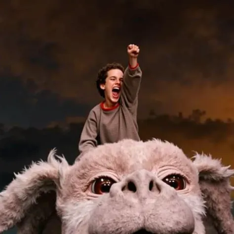 A boy with a triumphant expression raises his fist in the air while riding on the back of the large, fluffy, dragon Falkor from Neverending Story with a joyful appearance. The background features a dramatic sky, blending dark clouds with a golden glow, sug...