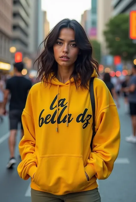 young woman, pretty, mixed race, Colombian Moroccan, black hair, green eyes, standing, in the middle of a large avenue, yellow hooded sweatshirt, written: la bella Dz in black