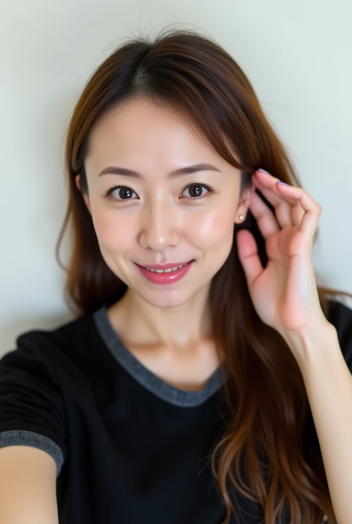 An overhead view of an Asian  woman, with long, straight brown hair reaches all around her shoulders. She's head in two rows, her left side by a small amount of water on her face. Her eyebrows, their eyes are slightly turned to the side, with a few of them...