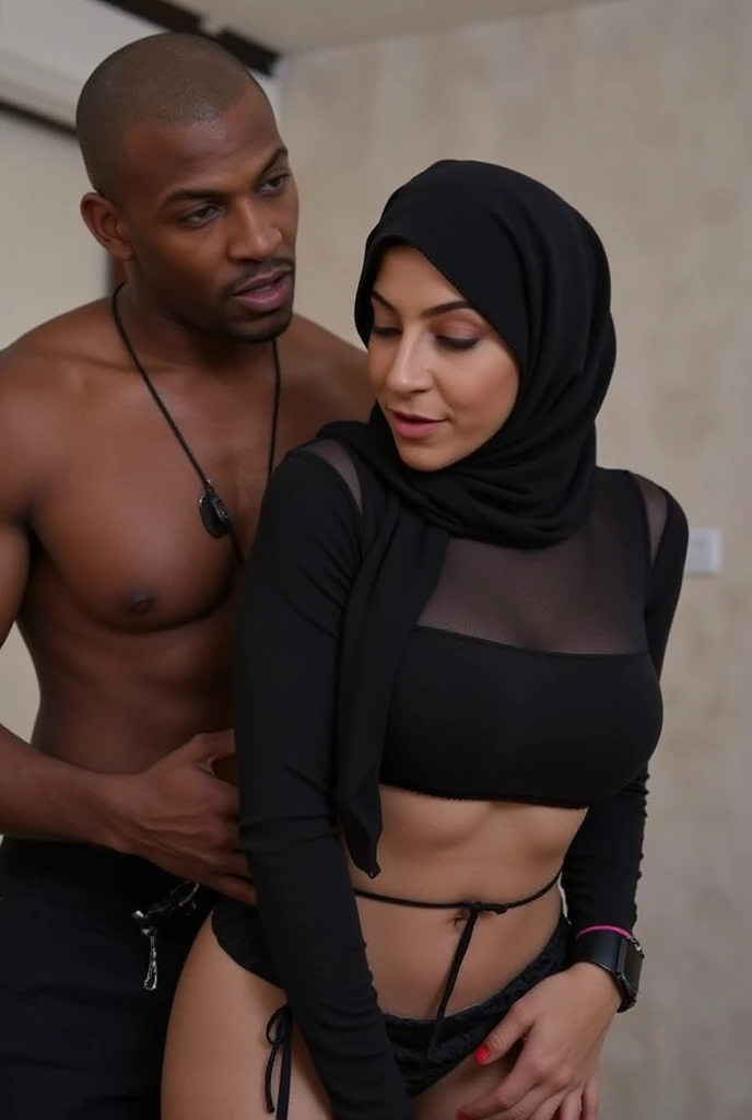  A shirtless african black bald man is holding a 50-year-old busty Indian girl of hourglass figure wearing black croptop . head covered by hijab . The woman is wearing low waist black pants . Both are holding each other tightly. The woman is fighting back.