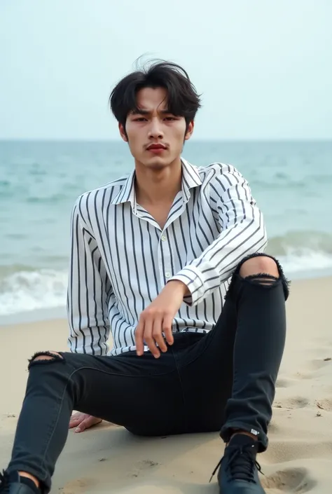 Photo of a Korean bloke wearing a white black striped shirt and black long jeans ripped knee black sneackers, Relaxing on the beach 