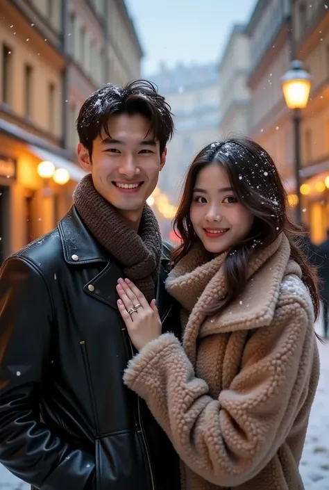 
 A smiling young Korean man and woman staring at the camera are standing on a snowy city street,  surrounded by old European-style buildings with golden glowing windows ..  Men have short dark hair that is slightly messy ,  wearing a leather jacket dark-c...