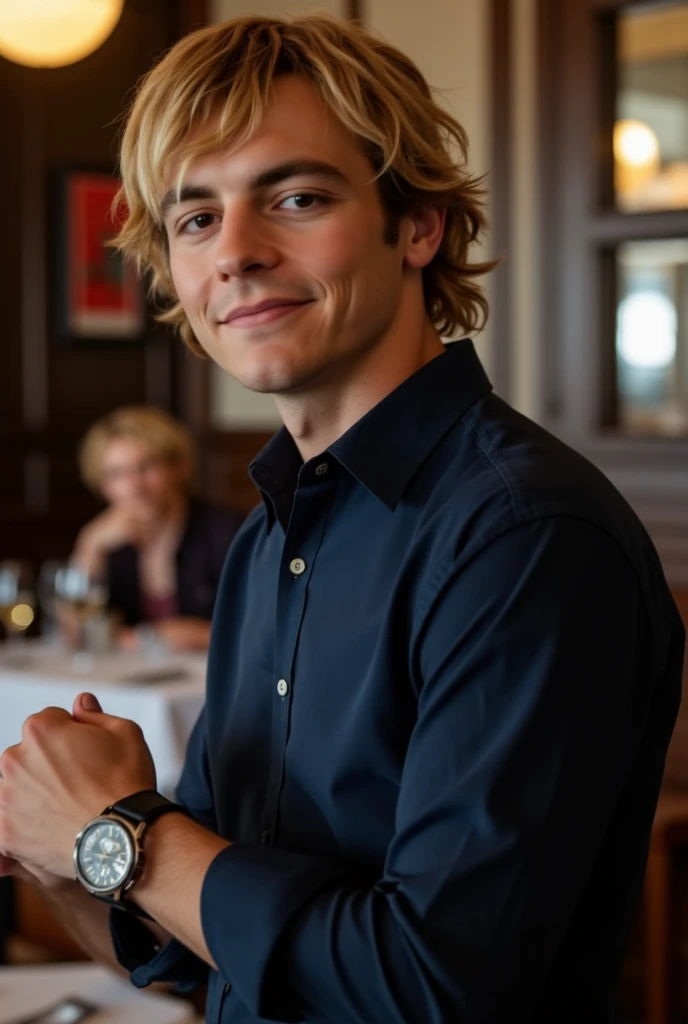 Ross Lynch at a restaurant wearing a deep blue button-up shirt and an expensive watch.  His hair is shoulder length and tucked behind his ears.  Side profile.