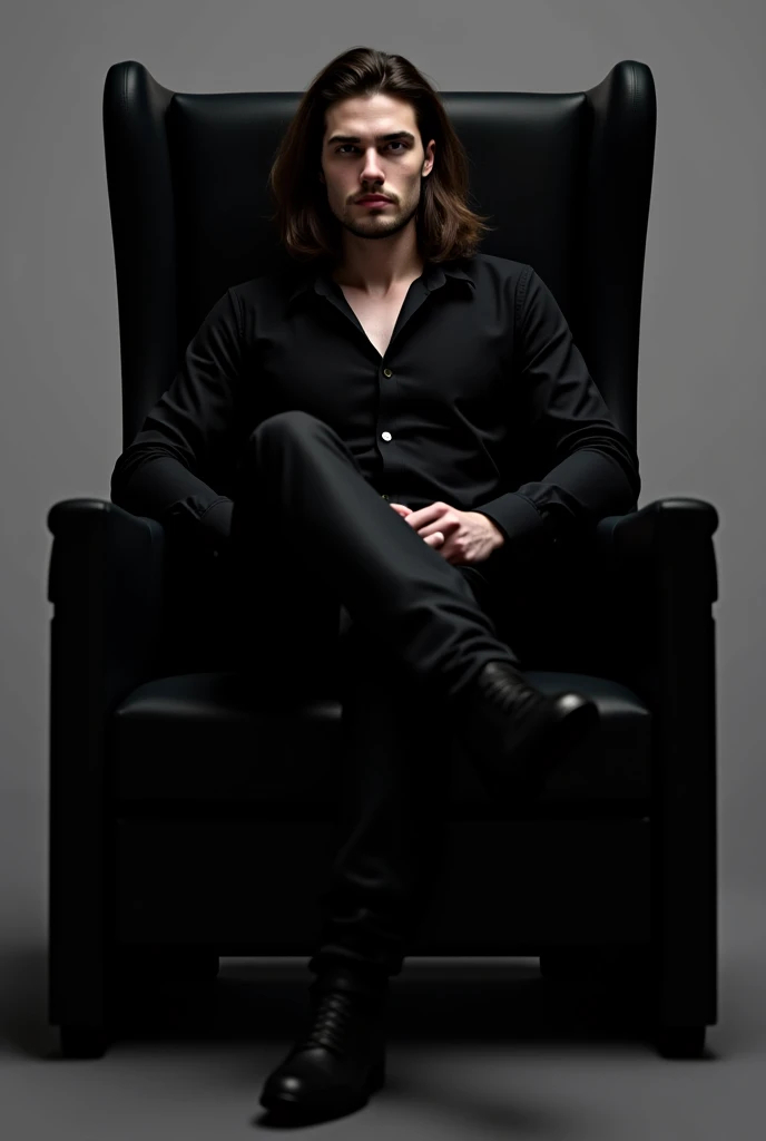 Handsome and long-haired man sitting on a black chair