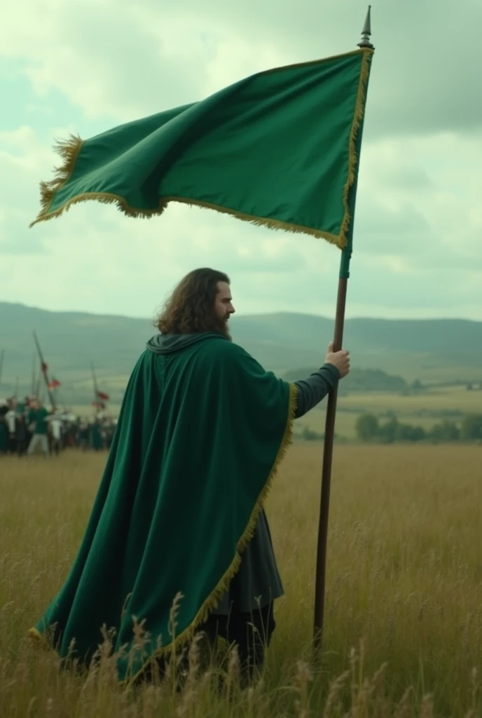 there is a man holding a green flag in a field, wearing green cloak, wearing a green cloak, with a green cloak, standing in the plains of rohan, green flag, green cloak, green flags, invading army background, standing on the field of battle, green cape, st...