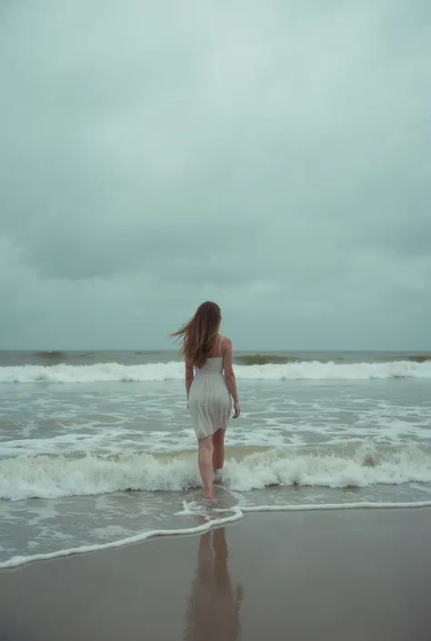 **A beautiful, solitary woman stands on the shore of Wrightsville Beach where the sea meets the sand in a symphony of perpetual motion. The overcast sky casts a sombre glow. Her posture exudes a quiet melancholy as she navigates the shifting border between...