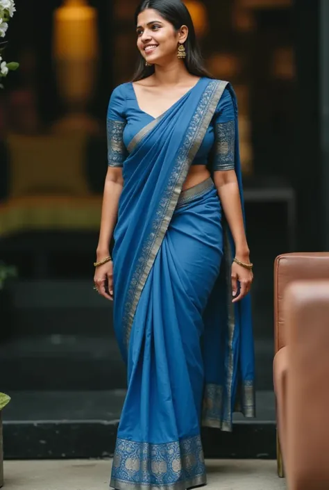 Medium built South Indian dark skinned aunty in a blue saree revealing waist 