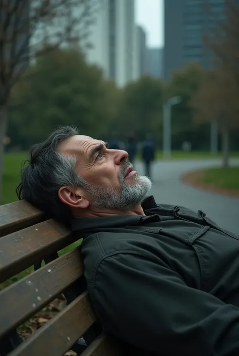 A man depprest laying on the bench