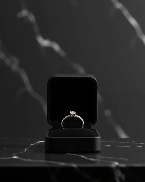  Create an elegant and minimalist scene showcasing a front view of a ring box with a diamond ring on it, black with white details marbled  background to enhance the luxurious feel. The overall aesthetic should exude refined elegance and timeless beauty. En...