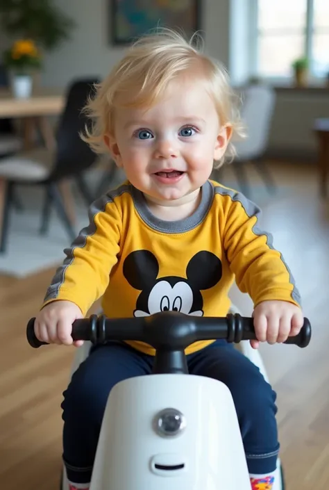  A beautiful baby boy is riding a stylish white motorbike with black details . He wears a yellow long sleeve blouse in shades of gray and blue,  with a large Mickey Mouse design on the front .  Her bright blue eyes contrast with her light face and light bl...