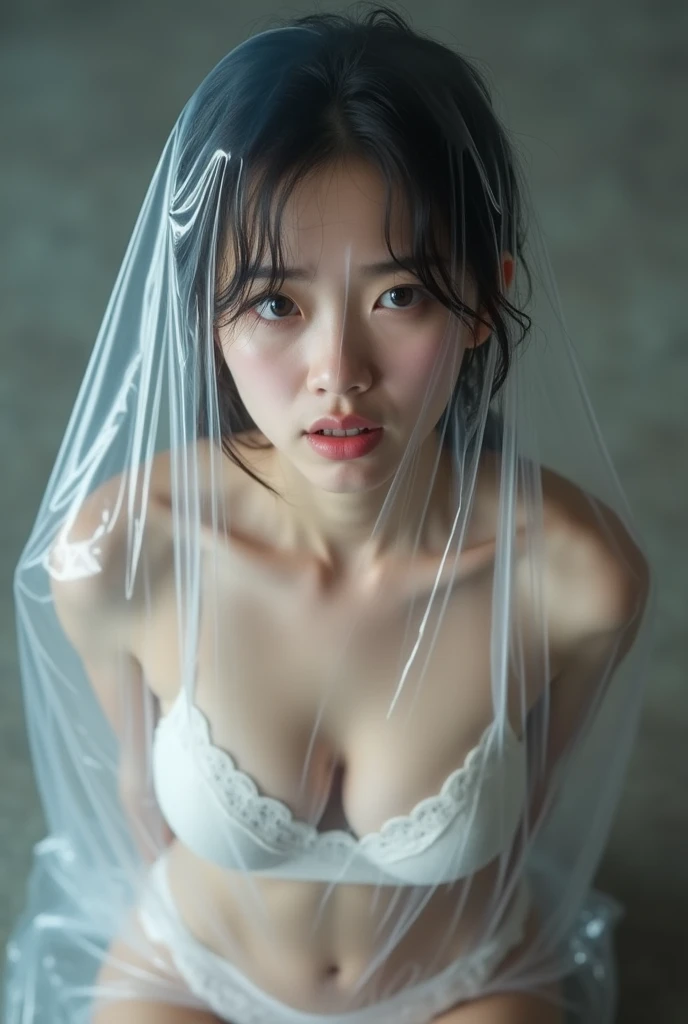 Japanese Girl Wearing Full Body Transparent Latex Dress,Transparent Latex Underwear,is tied in a transparent plastic bag that completely sucks out air. , , her face showing pain because of suffocation..  top view.