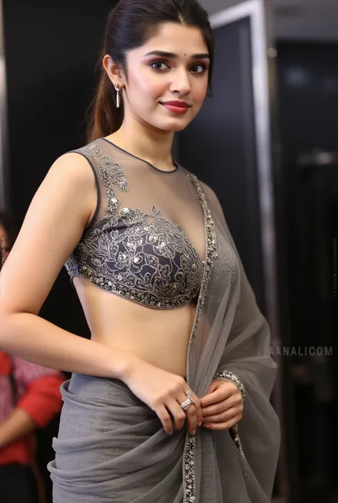 A woman in a form-fitting transparent saree that hugs her curves. The transparent dress has a daring cutout near the neckline, revealing a hint of her skin. She stands confidently, her eyes filled with intrigue, as she begins to remove the dress