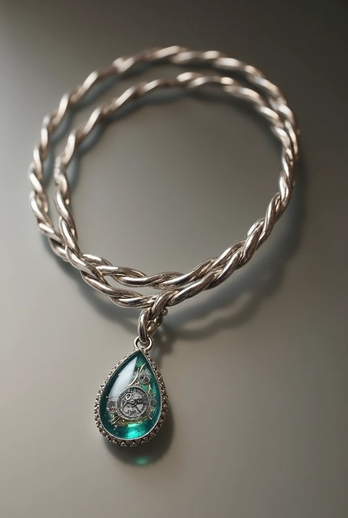 Bracelet with two silver cords with small droplet pendant, with a watch inside the droplet 