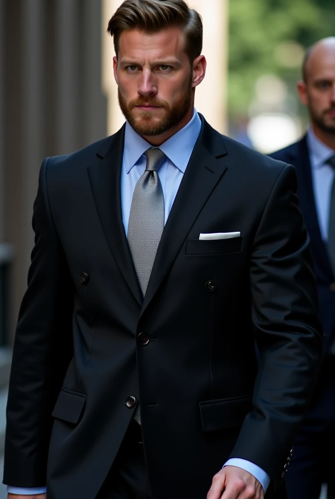 Handsome tall and strong white man with short brown hair with a short beard wearing a black suit with a light blue shirt and silver tie his eyes flash yellow as he walks behind him there are dark shadows